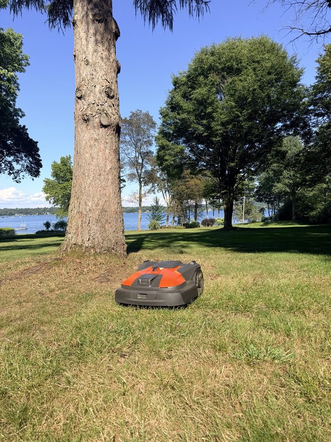 Robotic mower operating on a large property