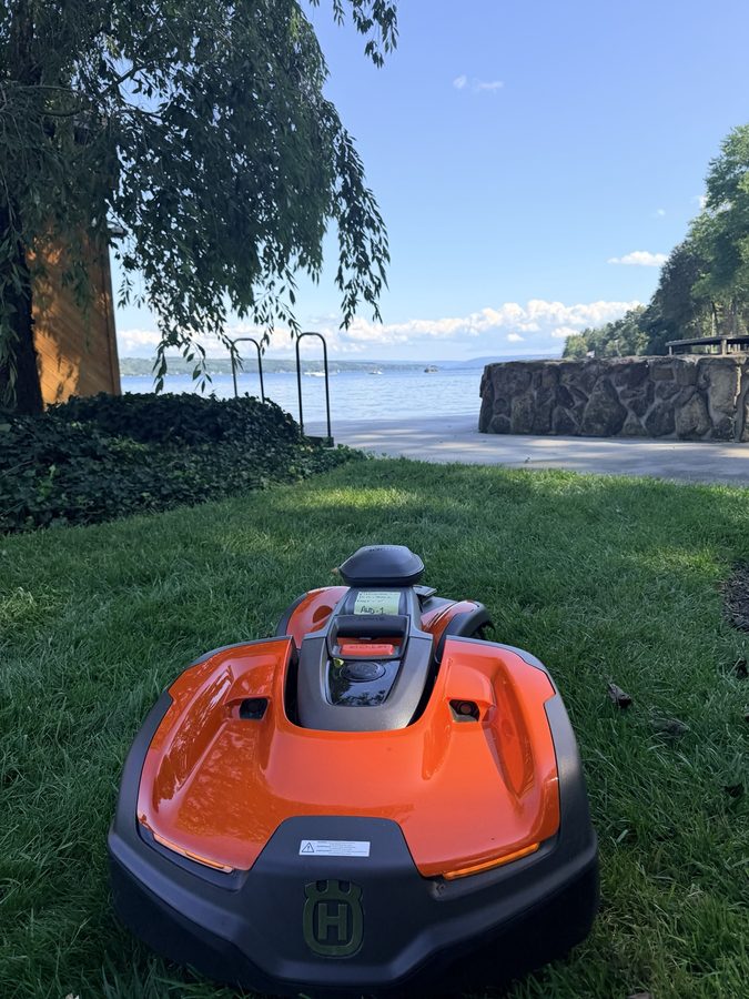 Robotic mower operating on a Western New York property